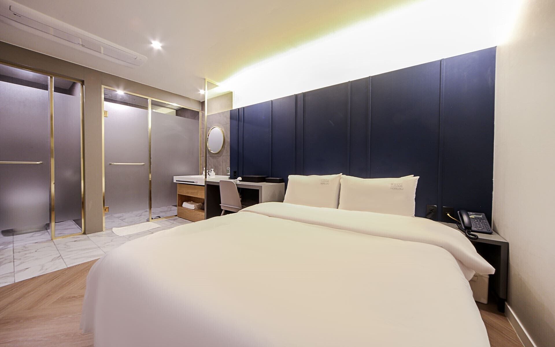 deluxe room | premium bedding, desk, laptop workspace, blackout curtains