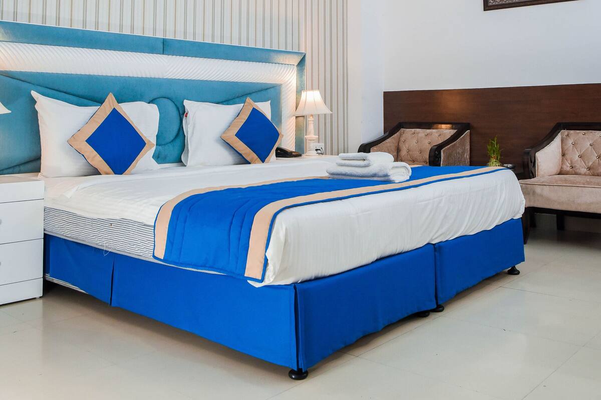 Premium bedding, blackout curtains, soundproofing, iron/ironing board