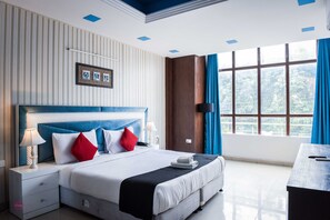 Premium bedding, blackout curtains, soundproofing, iron/ironing board