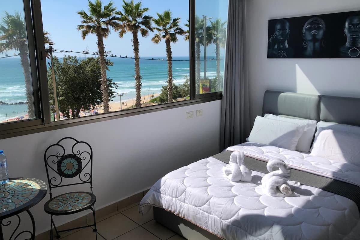 Classic Studio, Sea View | Down comforters, minibar, desk, iron/ironing board