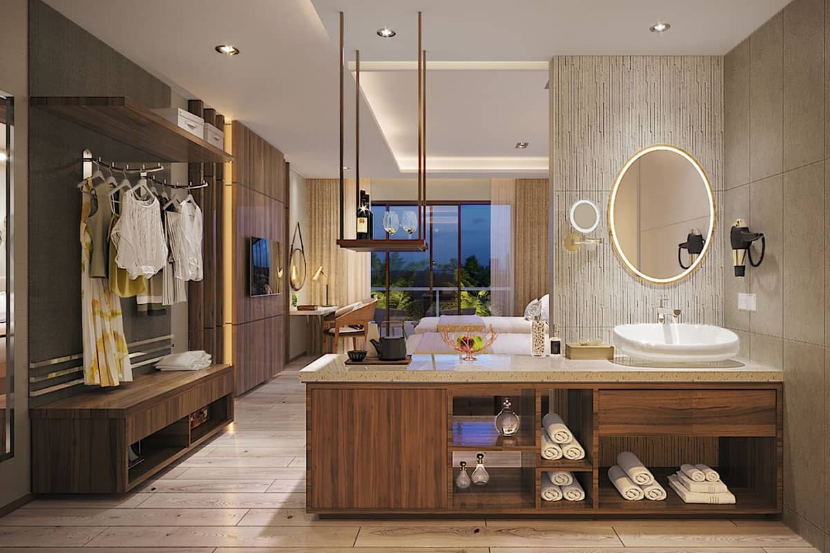 A modern bathroom with a wooden vanity, a large mirror, and a built-in sink.