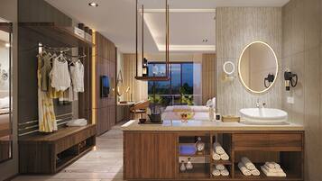 A modern bathroom with a wooden vanity, a large mirror, and a built-in sink.