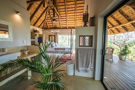 Luxury Baobab Tree Cottage (1) | Premium bedding, Select Comfort beds, minibar, individually decorated. The Wild Blue Lodge SAFARI & SPA