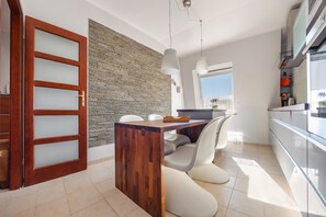 Apartment (Łokietka 49A/13) | Private kitchen | Fridge, stovetop, electric kettle, cookware/dishes/utensils