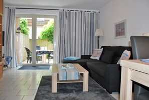 Apartment, 1 Bedroom, Terrace, Ground Floor | Living room | Flat-screen TV