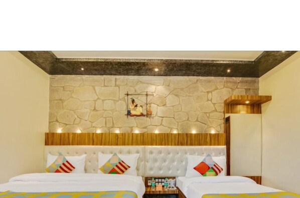 Deluxe Triple Room | Living area | 32-inch LED TV with satellite channels, TV