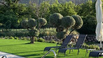 Seasonal outdoor pool, open 10:00 AM to 8:30 PM, pool umbrellas