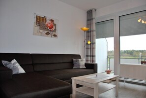 Apartment, 1 Bedroom, Balcony | Living room | TV