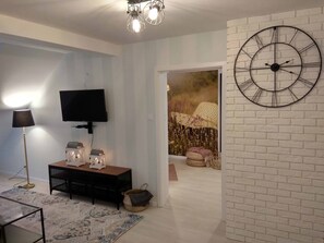 Apartment, Mountain View | Living area | Flat-screen TV - Apartament Beztroski (Ustrzyki Dolne)