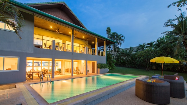 A two-story house with a swimming pool, outdoor seating, and a covered patio area. - Viola Pool Villa (Rawai)