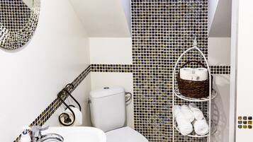 Apartment, 2 Bedrooms | Bathroom | Shower, rainfall showerhead, hair dryer, towels