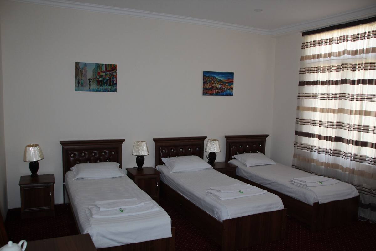 Standard Triple Room | Laptop workspace, blackout drapes, WiFi (free), bed sheets
