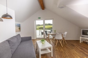 Comfort Apartment (Smilla) | Living area | Flat-screen TV, heated floors - Ferienwohnungen Am Mühlenberg (Lindlar)