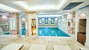 An indoor swimming pool with brick walls and a skylight ceiling. - Stara Čaršija Hotel and Spa (Bar)