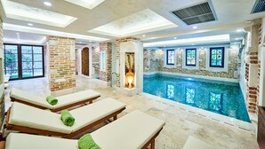 A poolside area with lounge chairs and a swimming pool. - Stara Čaršija Hotel and Spa (Bar)