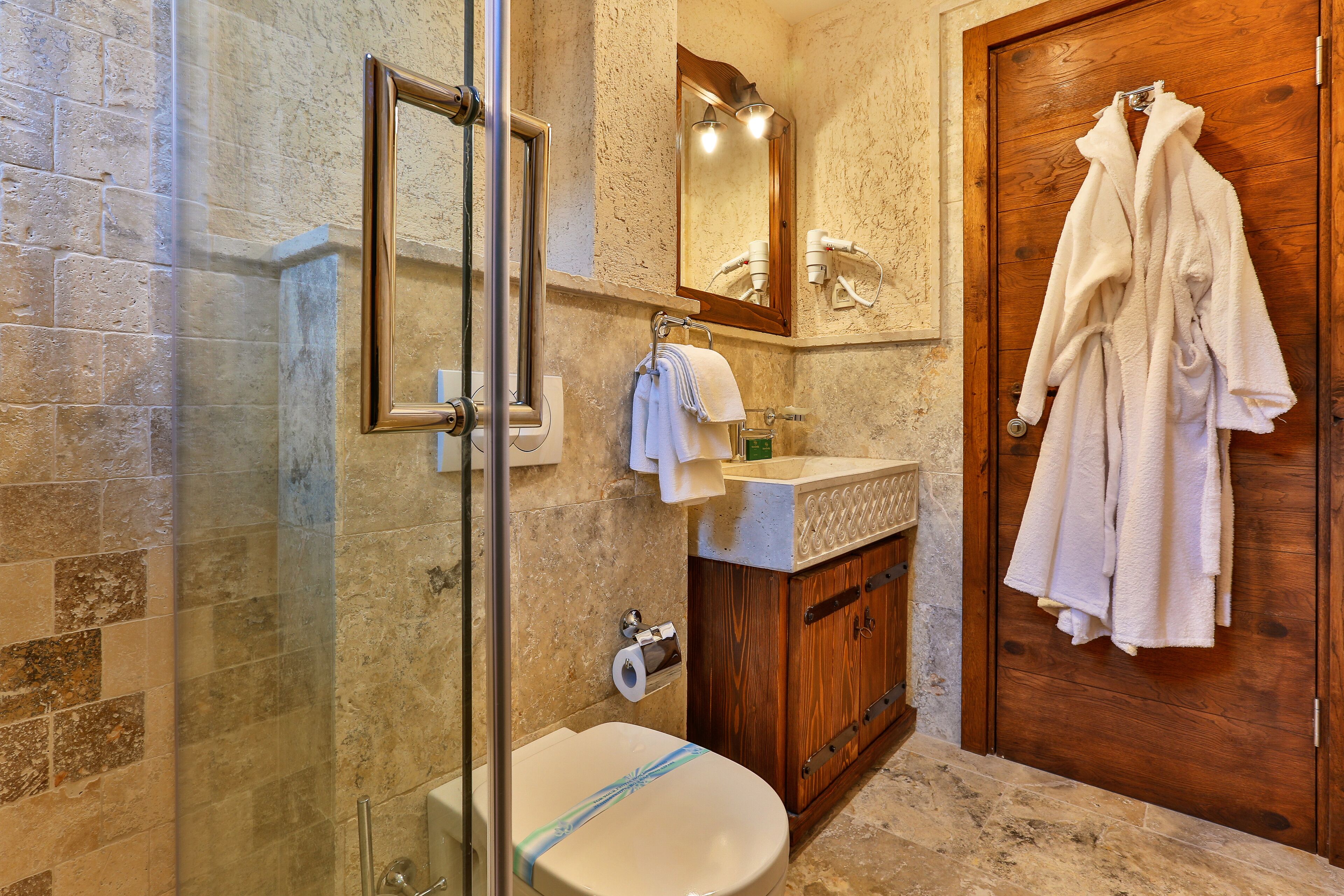 family studio suite | bathroom | shower, rainfall showerhead, hair dryer, bathrobes