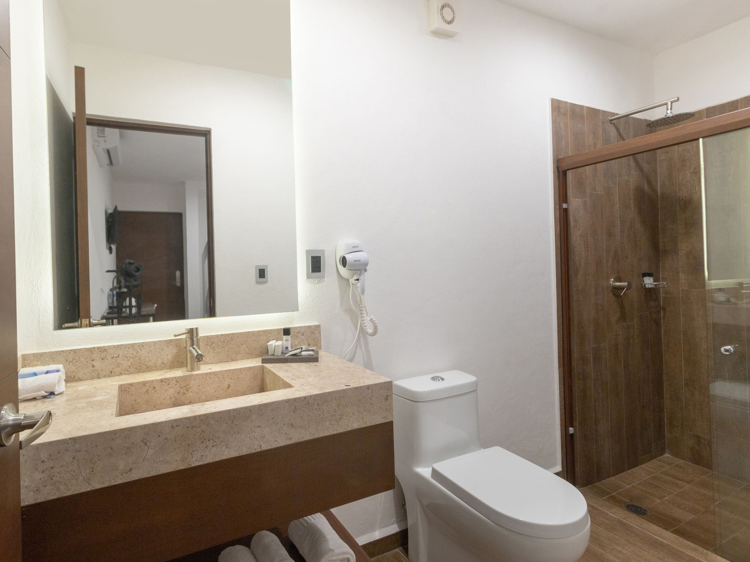 standard room | bathroom | shower, rainfall showerhead, hair dryer, bathrobes