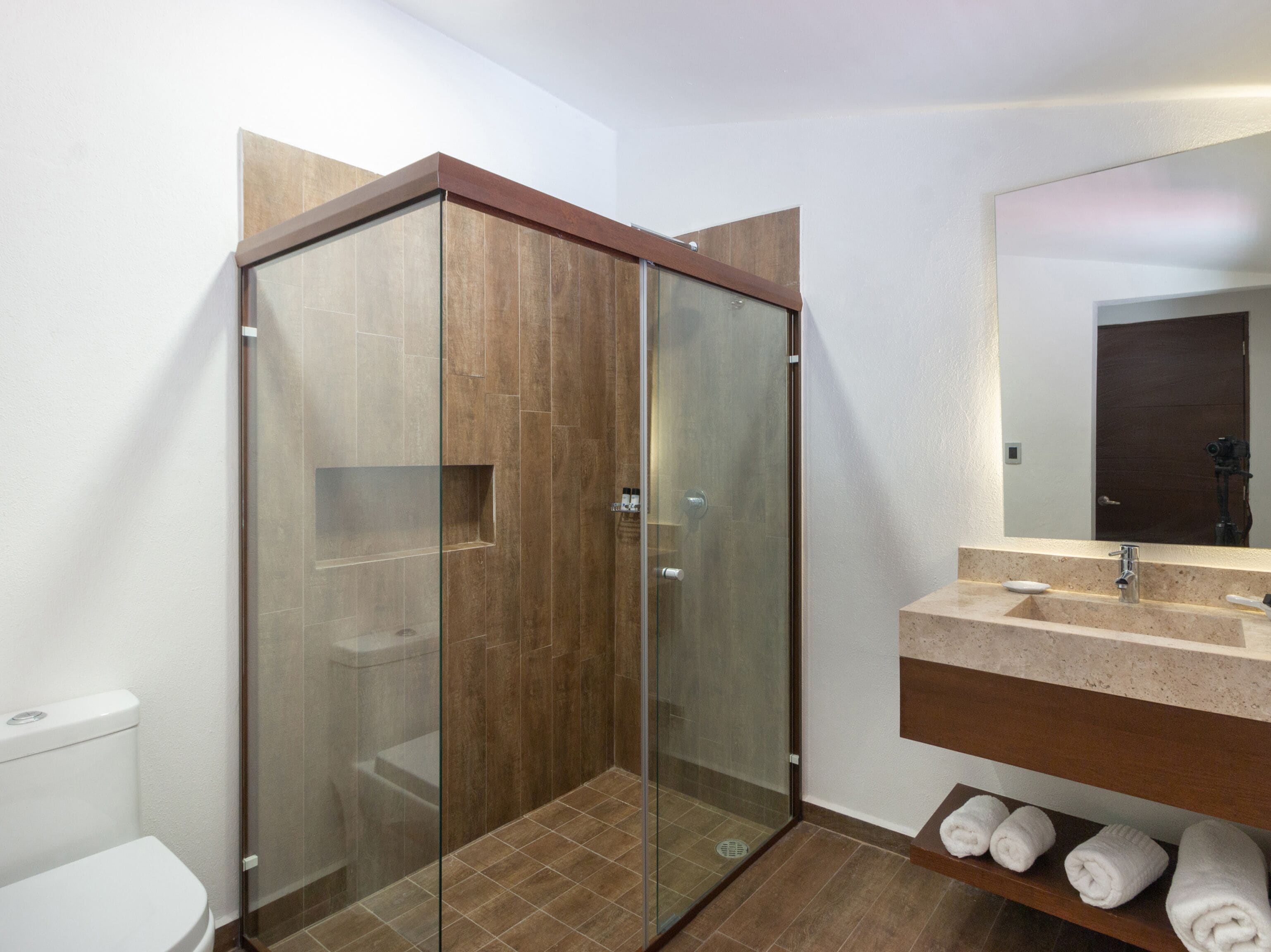superior room | bathroom | shower, rainfall showerhead, hair dryer, bathrobes