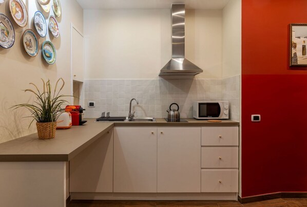 Microwave, stovetop, electric kettle, toaster