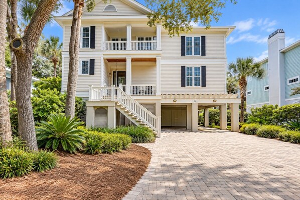 A multi-story building with a covered driveway and a staircase leading to the entrance. - 3 Bayberry-Recently Updated and 3rd Row Ocean w/ Private HEATED Pool (Hilton Head Island)