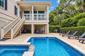 A two-story house with a swimming pool, outdoor furniture, and a covered patio area. - 3 Bayberry-Recently Updated and 3rd Row Ocean w/ Private HEATED Pool (Hilton Head Island)