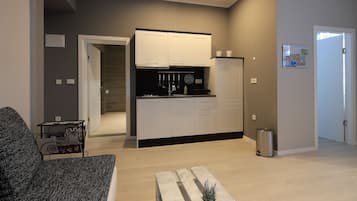 Apartment, 1 Bedroom | Living area | 80-cm flat-screen TV with satellite channels, TV