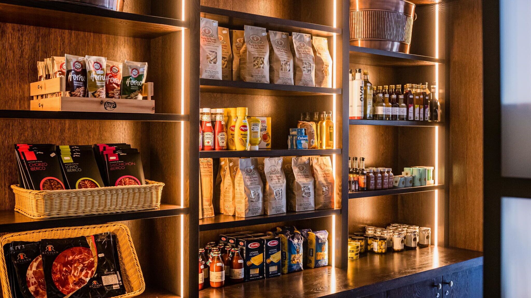 A well-organized pantry with various food items and condiments.