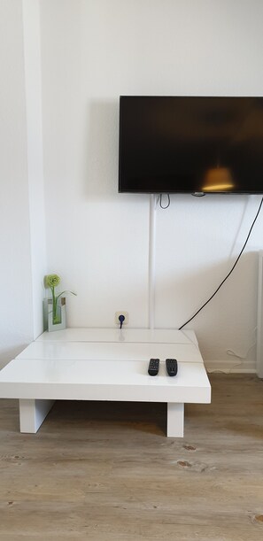 Departamento empresarial | Sala de estar | Televisión de pantalla plana 