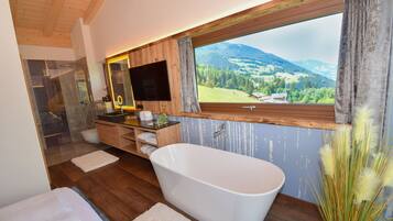 Bathtub, hair dryer, towels, soap