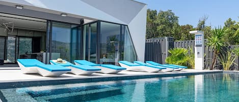 Seasonal outdoor pool, pool umbrellas, pool loungers