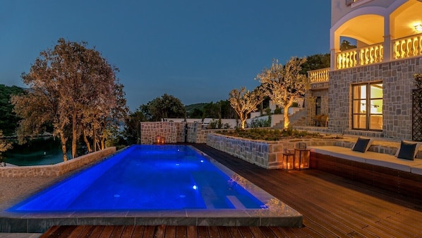 Seasonal outdoor pool, pool umbrellas, pool loungers