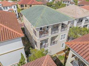 A multi-story residential building with balconies and a green roof. - Private Beach | Gulf Views | Comm Pool | Elevator (Destin)
