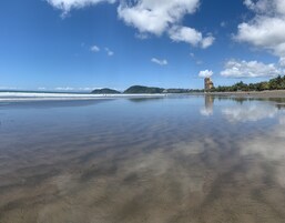 On the beach, black sand