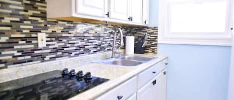 Fridge, microwave, stovetop, coffee/tea maker