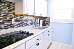 Fridge, microwave, stovetop, coffee/tea maker