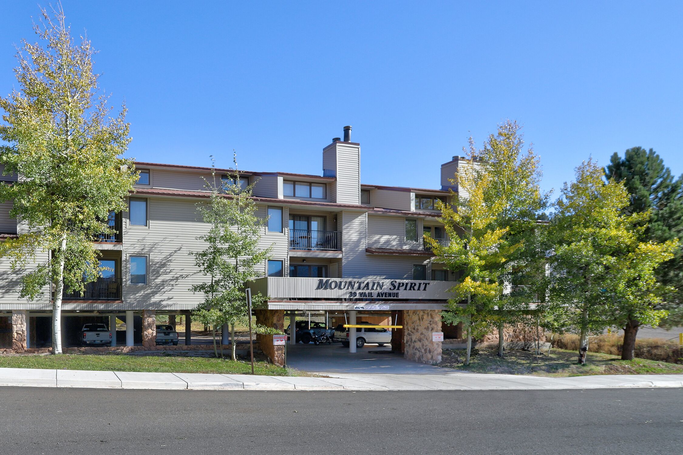 A multi-story hotel with a sign reading "Mountain Spirit" at 39 Wail Avenue.