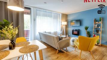 TV, fireplace, books