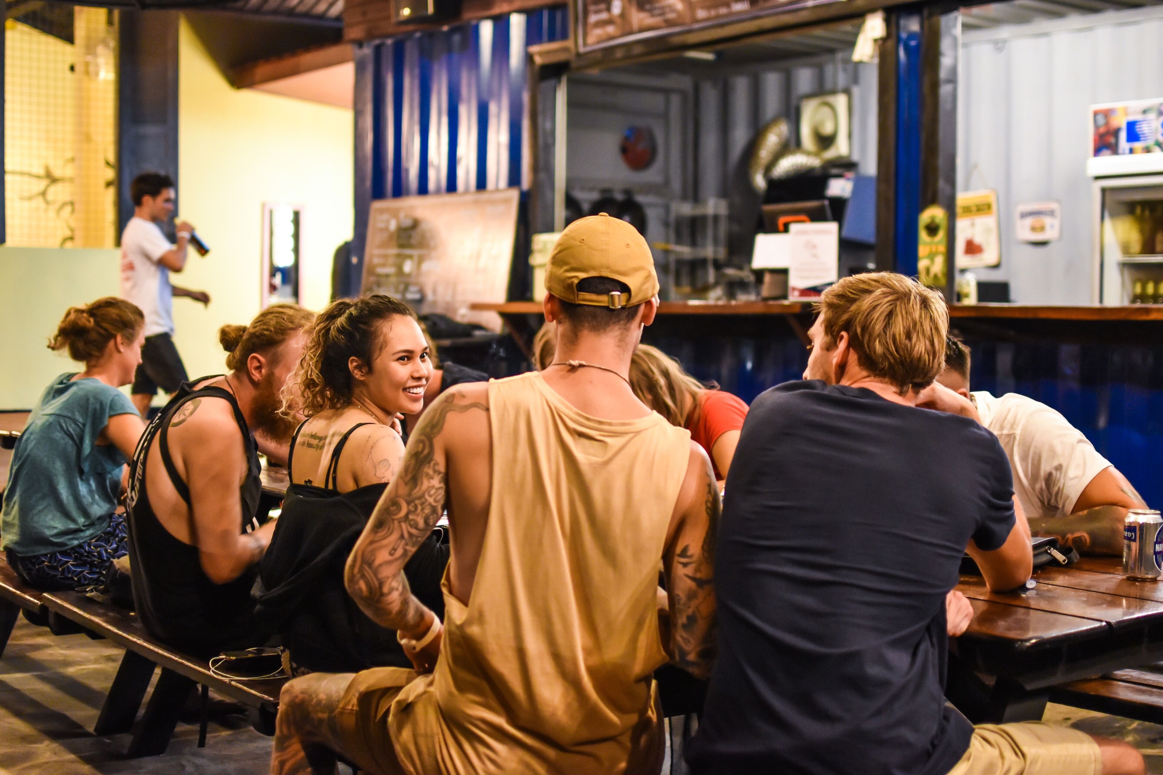 A casual dining restaurant with patrons seated at tables.