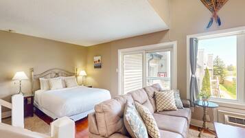 Tabla de planchar con plancha, internet y ropa de cama