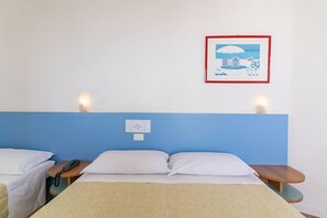 A hotel room with a single bed, bedside tables, a wall-mounted phone, and a framed picture. - Concord (Ravenna)