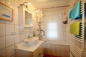 Combined shower/tub, hair dryer, towels, soap