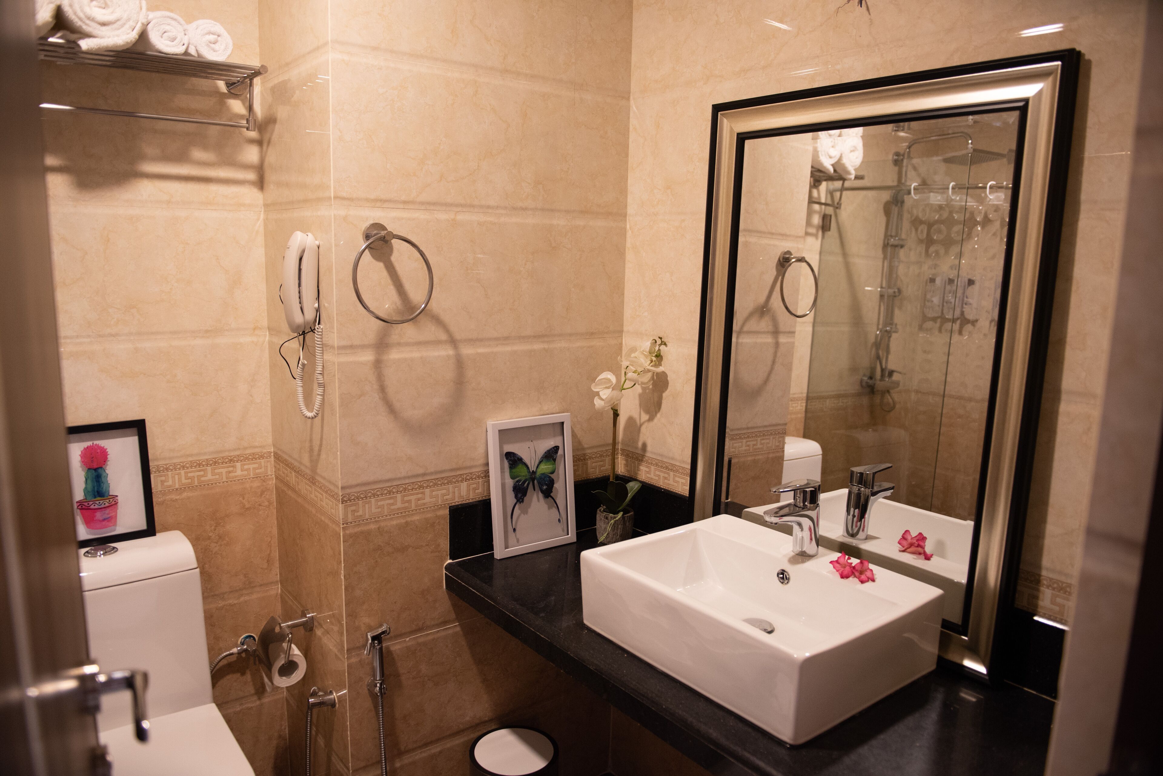 deluxe room, 1 king bed | bathroom | shower, rainfall showerhead, free toiletries, bathrobes