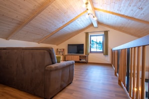 Family Chalet, 2 Bedrooms, Mountain View | Living area | 40-inch flat-screen TV with satellite channels, TV, table tennis