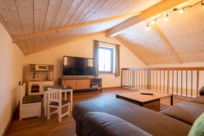 Family Chalet, 2 Bedrooms, Mountain View | Living area | 40-inch flat-screen TV with satellite channels, TV, table tennis
