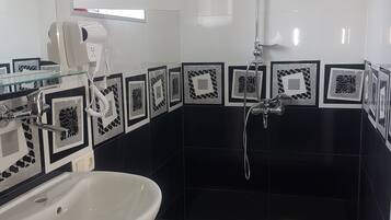 Premium Triple Room | Bathroom | Shower, hydromassage showerhead, hair dryer, soap