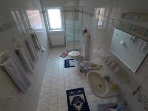 Shower, hair dryer, towels, toilet paper