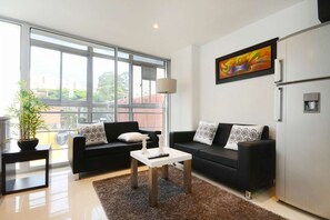 Living area - Two Bedroom Middle of Park lleras AC, Hot tub Bars downstairs (Medellin)