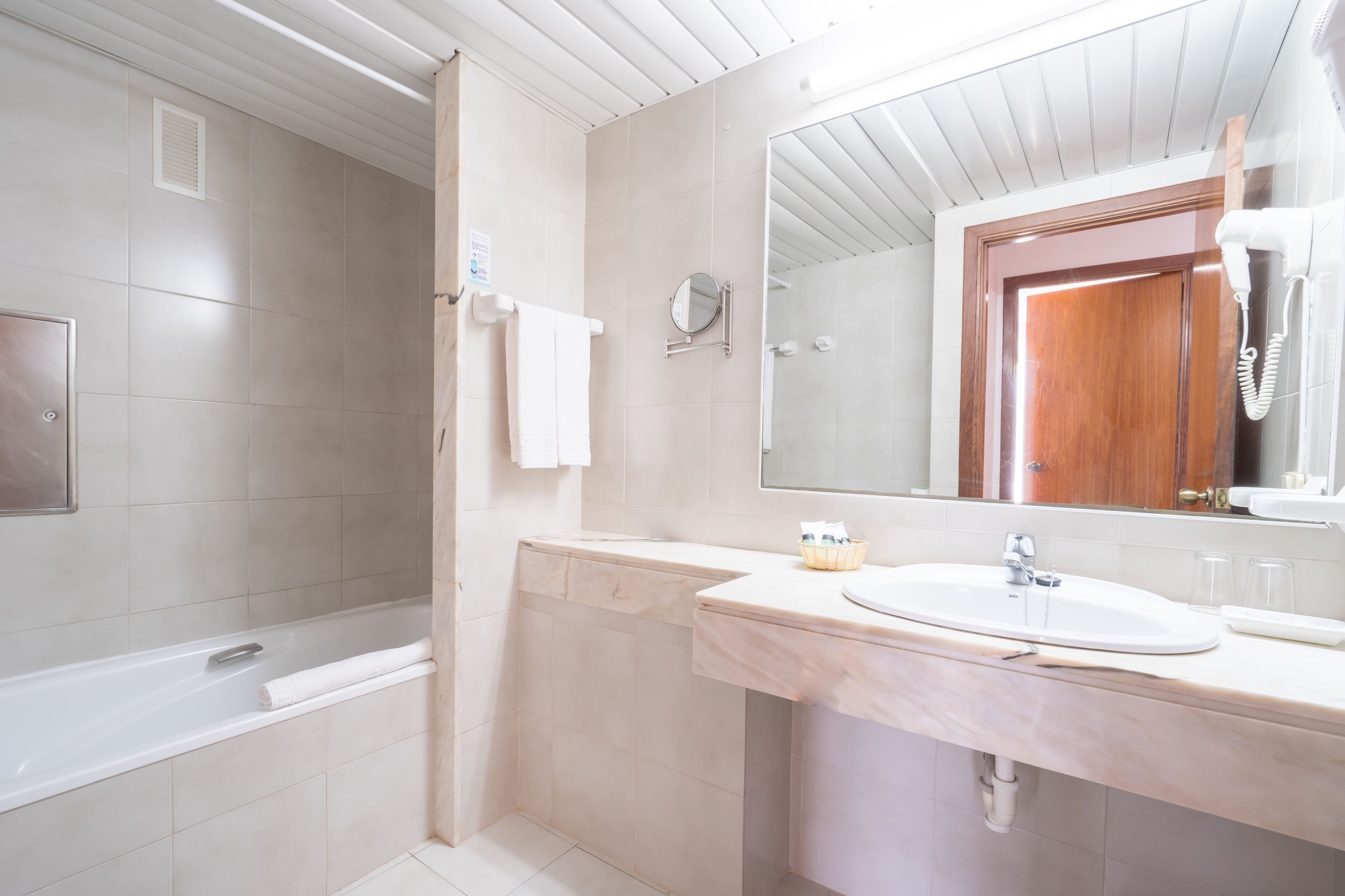 eco-friendly toiletries, hair dryer, towels