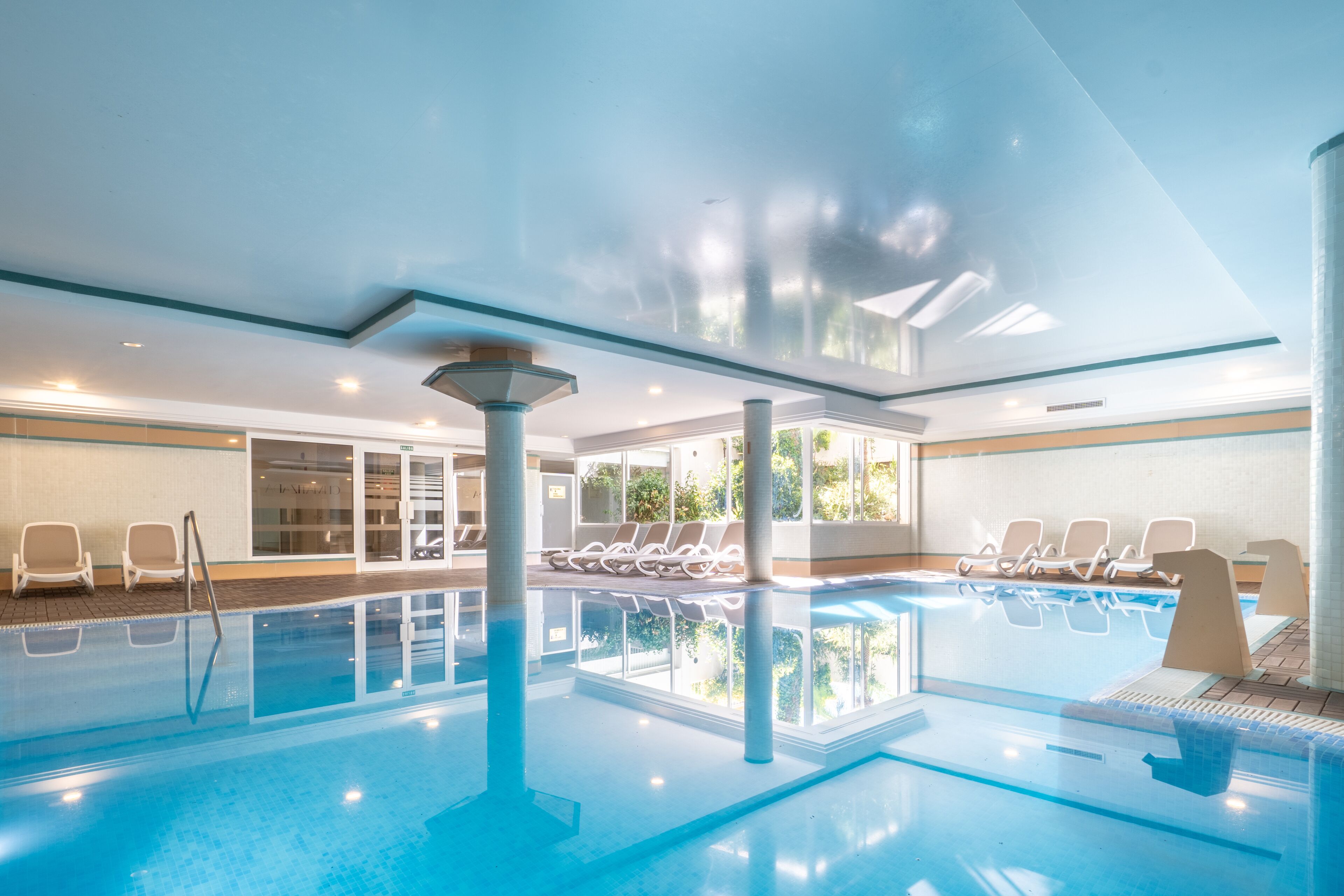 indoor pool, outdoor pool, open 10:00 am to 6:00 pm, pool umbrellas