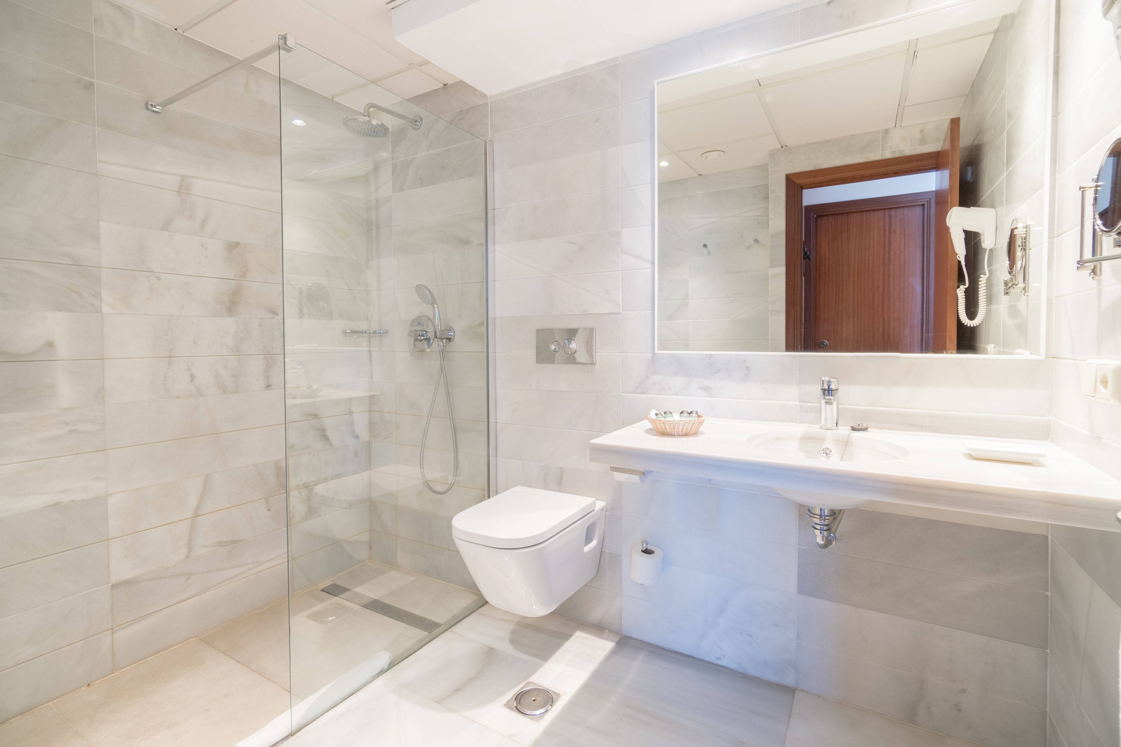 eco-friendly toiletries, hair dryer, towels